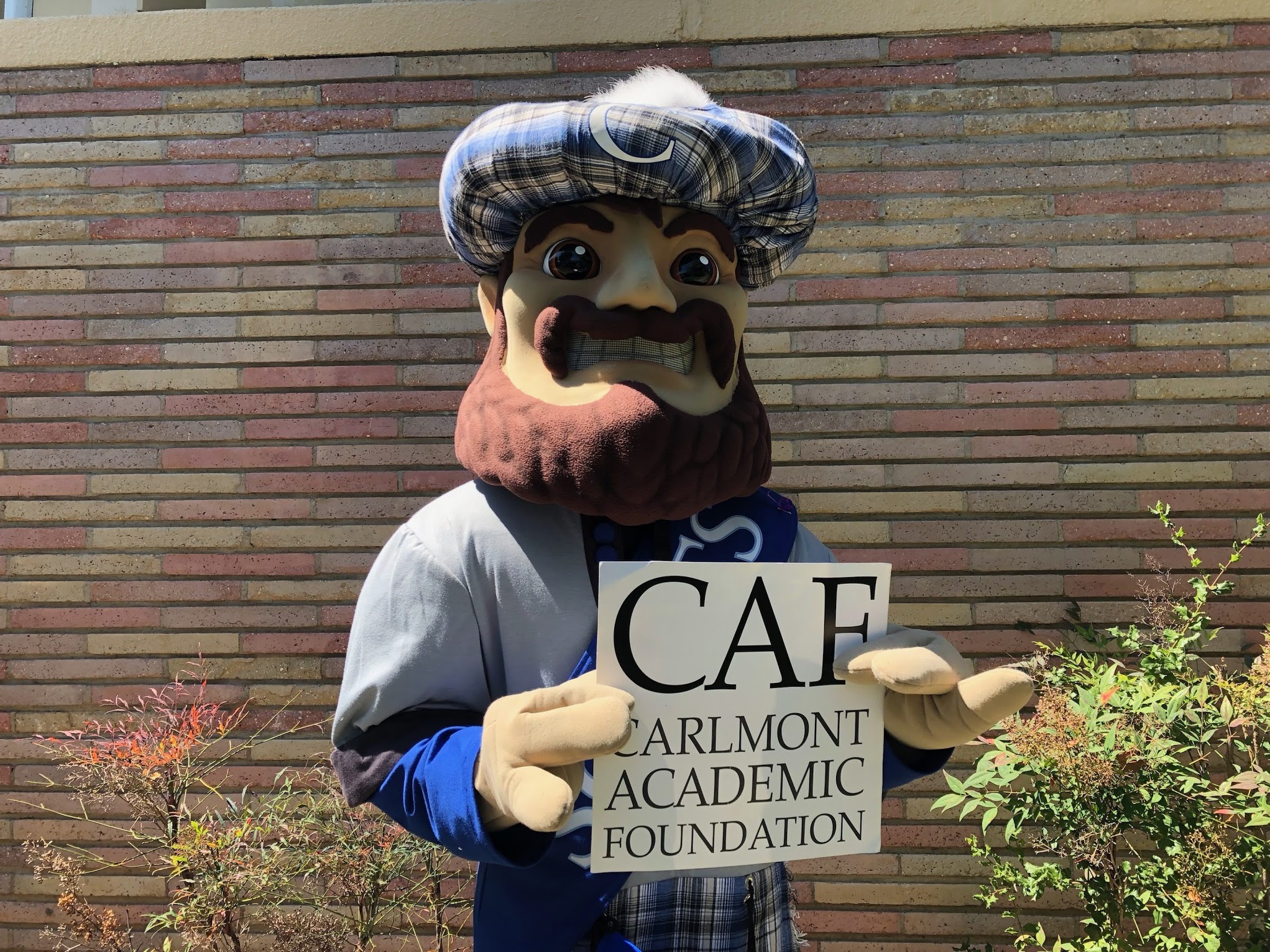 Monty holding CAF sign